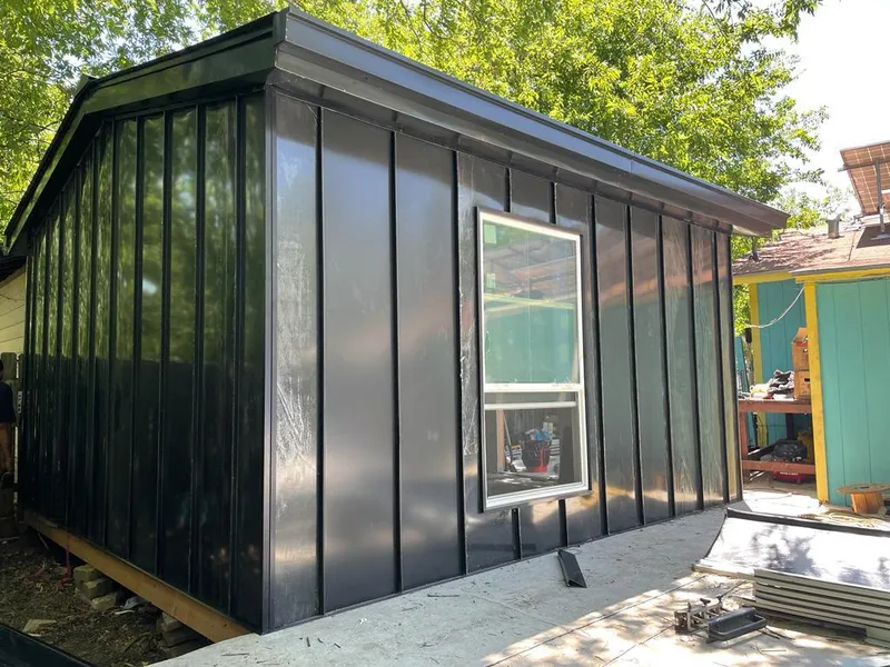 Black standing seam metal wall panels for Roof Inspection in Massac