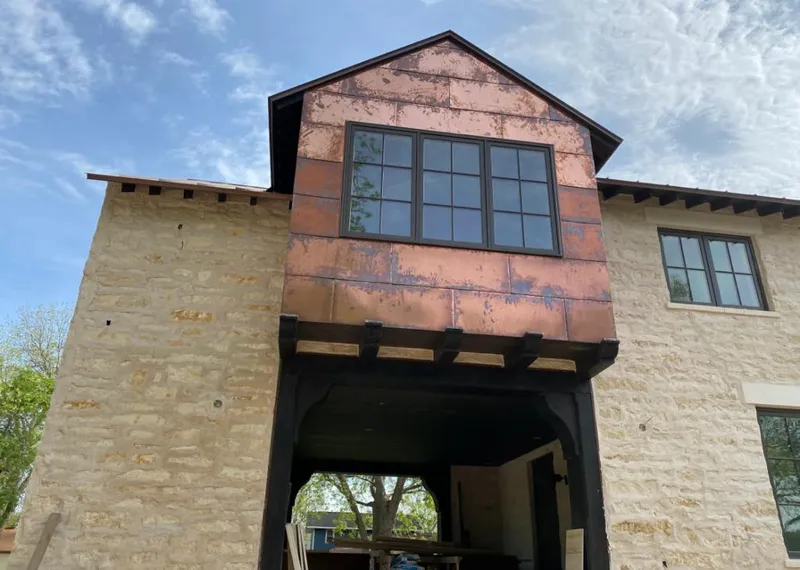 Copper metal panel facade on a stone building for Metal Roof Coating in Massac